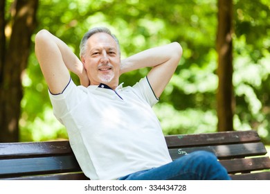 Senior Man Relaxing At The Park