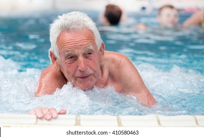 Senior Man Resting In Jacuzzi In Spa Resort