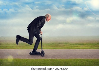 Senior Man Riding A Scooter Active And Energetic