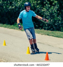 Senior Man Roller Skating In Park