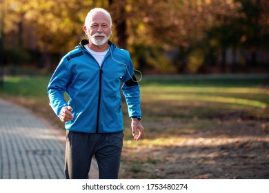 Senior Man Running In The Park.