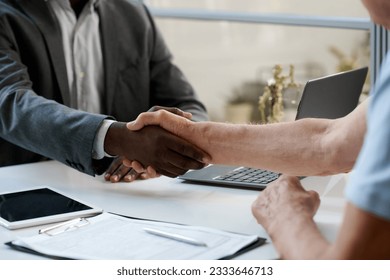 Senior man shaking hands with lawyer - Powered by Shutterstock