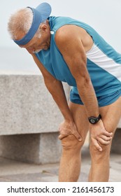 Senior Man With Shortness Of Breath After Long Distance Running Vertical Shot