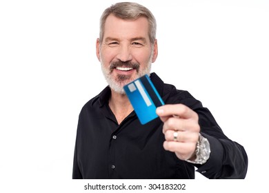 Senior Man Showing His Credit Card To Camera