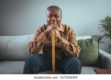 Senior man sitting at home with walking stock and smiling. Portrait of happy senior man sitting at home with walking stock and smiling. Portrait of nice cheerful positive cheery stylish old man - Shutterstock ID 2175343399