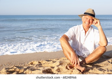 Senior Man Sitting On Beach Relaxing