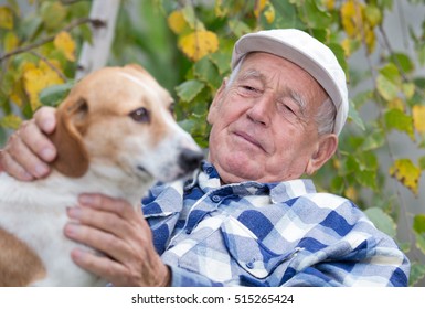 Senior man sitting on bench and cuddling his dog in courtyard - Powered by Shutterstock