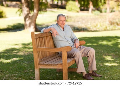 Senior Man Sitting On A Bench