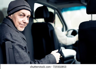 Senior Man Sitting In Paratransit Van