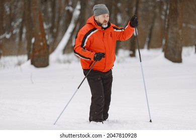 Senior Man Skiing Cross-country In A Forest