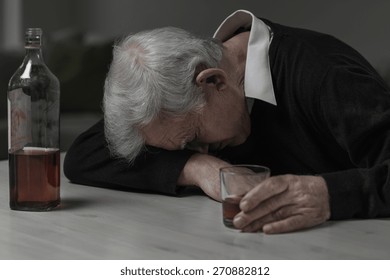 Senior Man Sleeping After Drinking Too Much Alcohol
