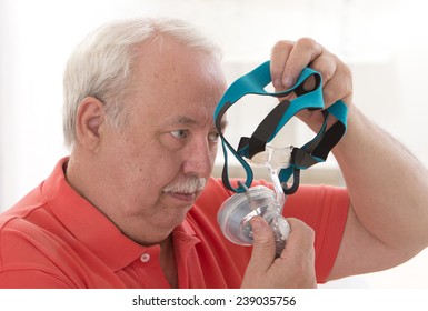 Senior Man With Sleeping Apnea And CPAP Machine