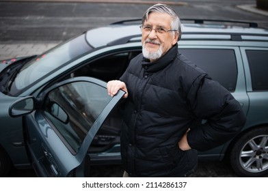 Senior man smiling, happy about his new car - Powered by Shutterstock