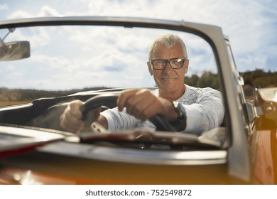 Senior Man In Sports Car