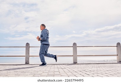 Senior man, sports and running at beach promenade with sky mockup for energy, body wellness and cardio workout. Elderly male, exercise and runner at seaside for training, fitness and healthy marathon - Powered by Shutterstock