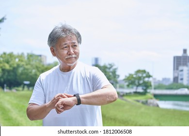 Senior Man In Sportswear Wearing A Smartwatch