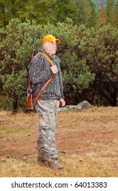 Senior Man Standing In Full Hunting Gear.