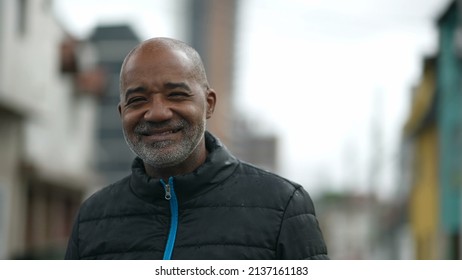 A Senior Man Standing Outside In The Rain Portrait Face