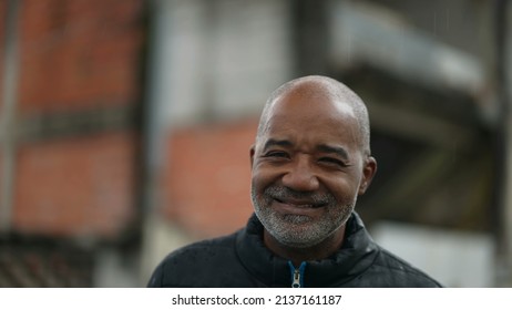 A Senior Man Standing Outside In The Rain Portrait Face