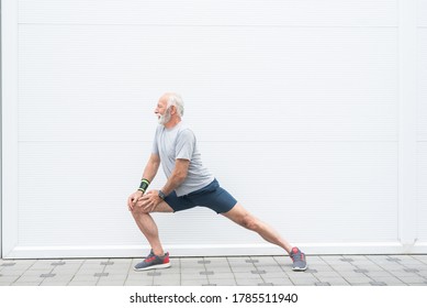 Senior man stretching legs before workout