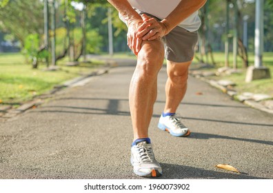 Senior Man Stretching Legs Muscle Before Running Or Jogging, Old Man Warming Up Exercise To Prevent Injury. Concept Healthcare In Elderly People                            