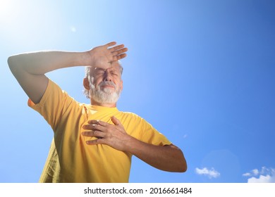 Senior Man Suffering From Heat Stroke Outdoors