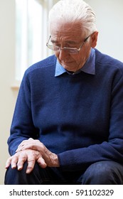 Senior Man Suffering With Parkinsons Diesease