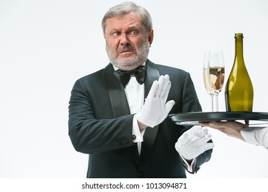 The Senior Man In Suit Complaining For The Bad Wine Isolated On White Studio Background. Concept Of Bad Service