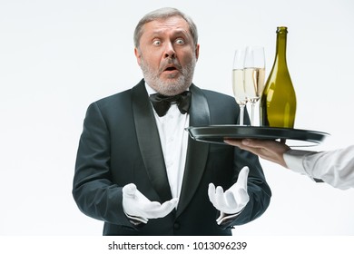 The Senior Man In Suit Complaining For The Bad Wine Isolated On White Studio Background. Concept Of Bad Service