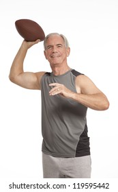 Senior Man Throws A Football