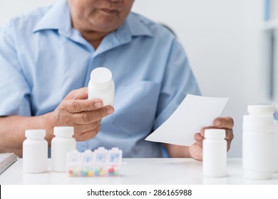 Senior Man Trying To Understand The Prescription