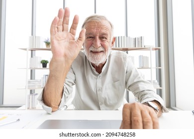 Senior Man Typing Keyboard On Laptop Computer And Say Hello Or Goodbye With Someone From Chat Online