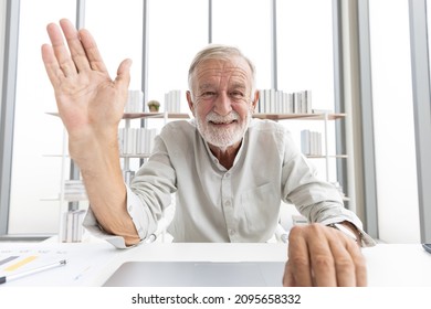 Senior Man Typing Keyboard On Laptop Computer And Say Hello Or Goodbye With Someone From Chat Online