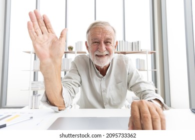 Senior Man Typing Keyboard On Laptop Computer And Say Hello Or Goodbye With Someone From Chat Online