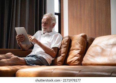 Senior man using digital tablet at home. The use of technology by the elderly. - Powered by Shutterstock - Get 15% off with code: PIKWIZARD15