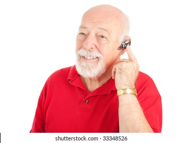 Senior Man Using A Hands-free Mobile Phone Ear Piece.  Isolated On White.