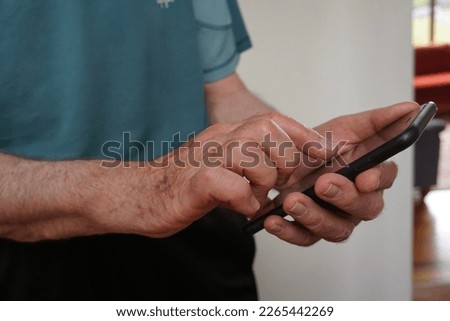 Senior man using his mobile phone