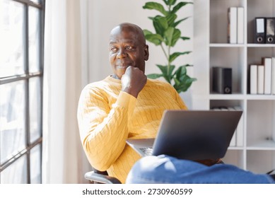 Senior man using laptop computer 
