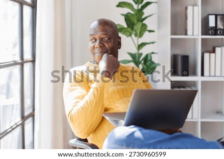 Senior man using laptop computer 
