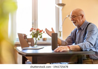 Senior man using Virtual Assistant at home
 - Powered by Shutterstock