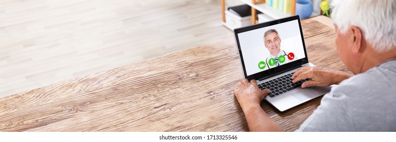 Senior Man Video Conferencing With Doctor On Laptop