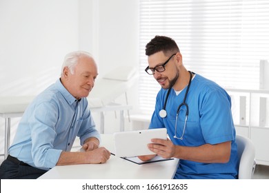 Senior man visiting doctor in modern office