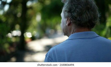 Senior Man Walking Outside In Nature. Back Of Older Person In A Path Walk