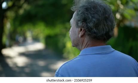 Senior Man Walking Outside In Nature. Back Of Older Person In A Path Walk