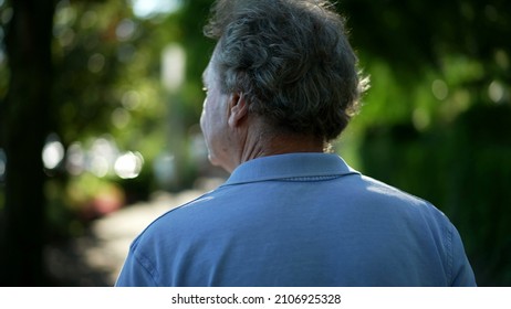 Senior Man Walking Outside In Nature. Back Of Older Person In A Path Walk