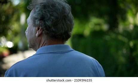 Senior Man Walking Outside In Nature. Back Of Older Person In A Path Walk