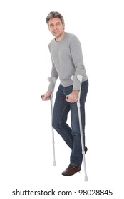 Senior Man Walking Using Crutches. Isolated On White