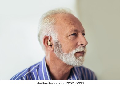 Senior Man Wearing Hearing Aid