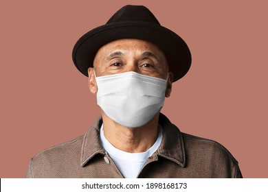 Senior man wearing mask for Covid-19 campaign studio shoot