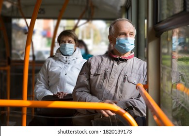  Senior man  wearing medical face mask sitting in the bus transport. - Powered by Shutterstock